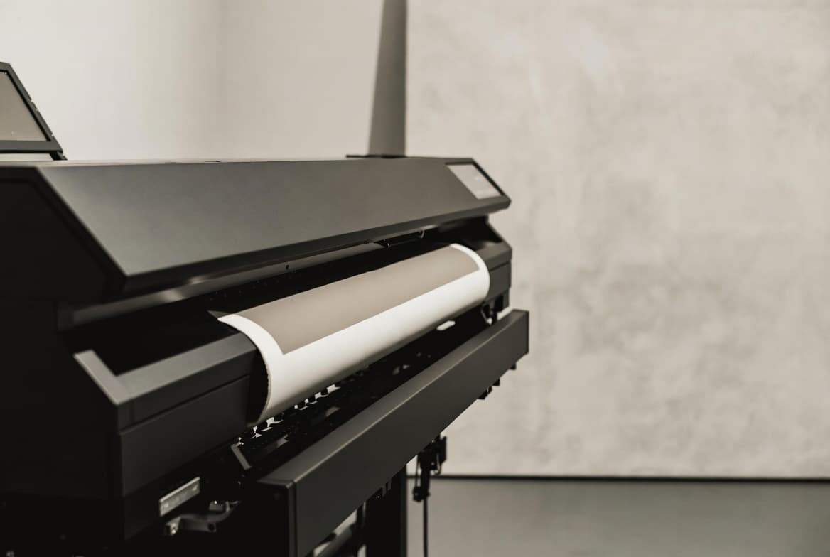 Hands with gloves holding print